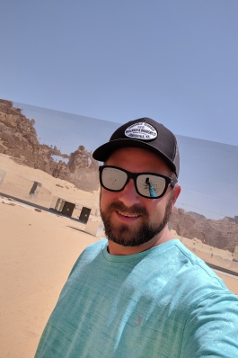 Neal Alfano in a desert landscape in Saudi Arabia