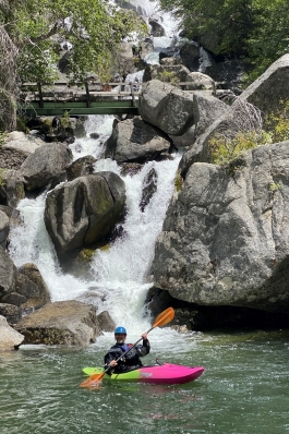 Pat Attkisson on a kayak in front of a waterfall in Idaho