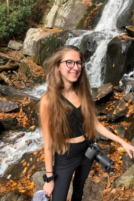Sarah Katz next to a waterfall in the Smoky Mountains