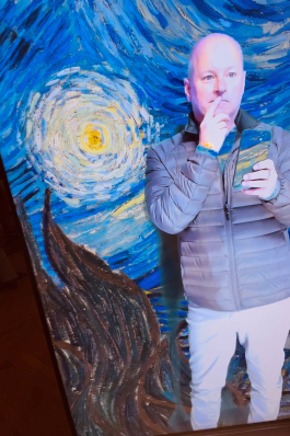 Steven Keith in front a Van Gogh Experience projection