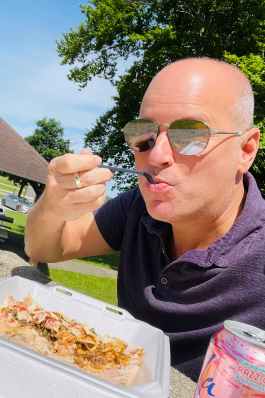 Steven Keith eating takeout at a roadside park in Ohio