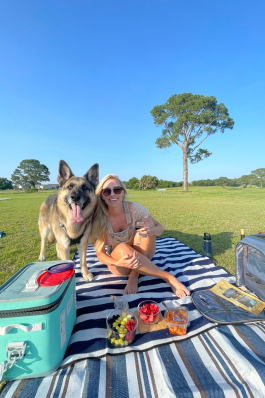 Summer Smith picnicking with her dog