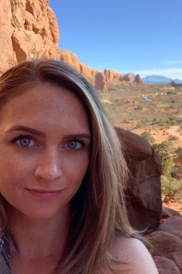 Kelby Miller in an arid landscape with red rocks and buttes