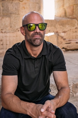 Jay Salyers sitting with sunglasses 