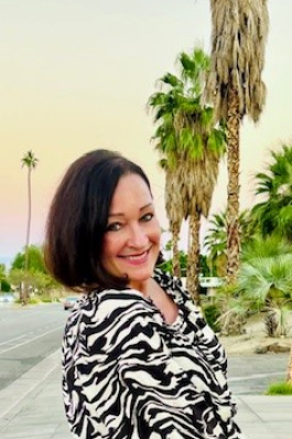 Demetria near palm trees