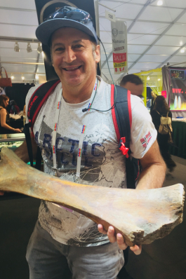 John Deleva holding a giant bone
