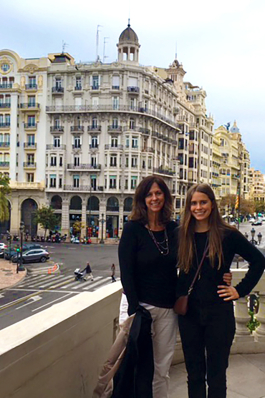 Julie Armstrong and her daughter standing on a patio