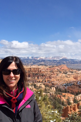 Julie Armstrong standing over a canyon