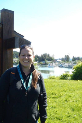 Karin Mast smiling in front of a lake