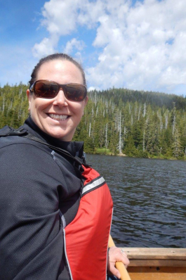 Karin Mast smiling in front of a forest