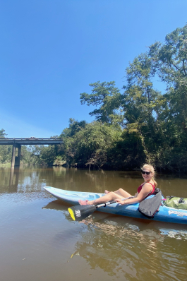 A photo of Anna canoeing on a river in Louisiana. 