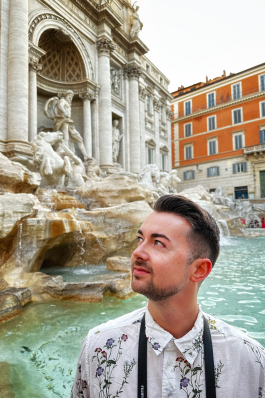 A photo of Joe near a fountain in Rome. 