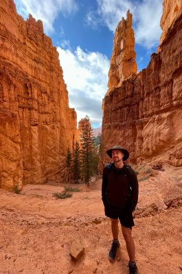 A photo of Joe in-between canyons in Utah.