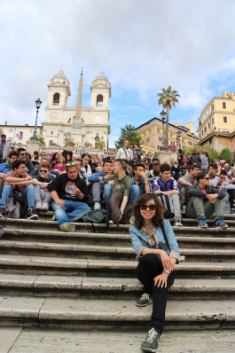 A photo of Wenjie on a crowded staircase in Rome. 