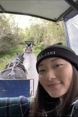 A photo of Tenzin in a horse carriage. 