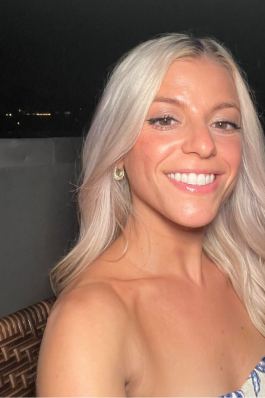 A selfie of Taylor on a rooftop.