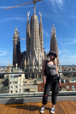 A photo of Christie behind a Spanish monument. 