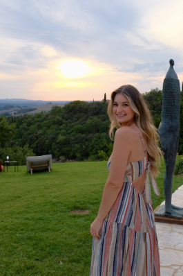 A photo of Taylor overlooking the Italian countryside. 