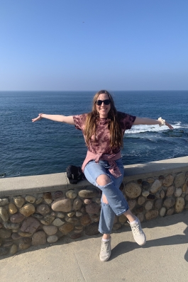 A photo of Andi near the ocean in San Diego.
