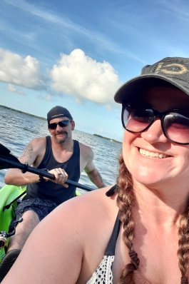 A photo of Kathy on a canoe.
