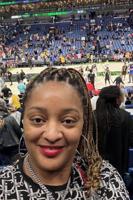 A photo of Jennifer at a basketball game in New Orleans. 