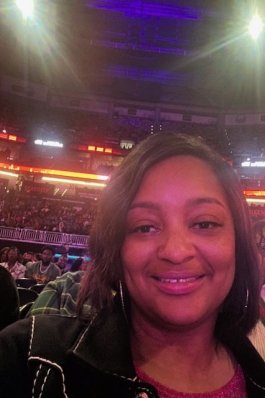 A photo of Jennifer in a sporting arena in Texas. 