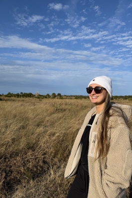 A photo of Jada overlooking a grassy field. 
