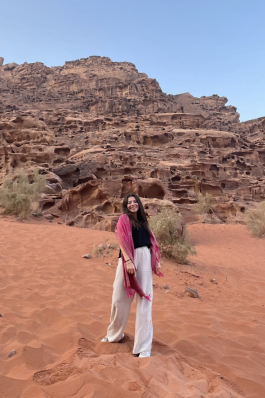 A photo of Maya in a desert in Jordan.