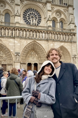 A photo of Kylie in front of a historical building. 