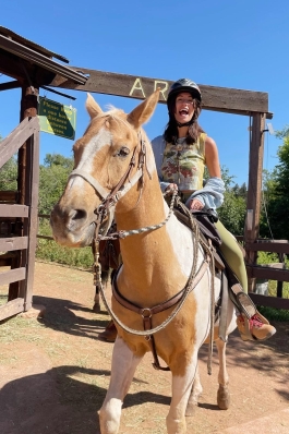 A photo of Kylie on horseback. 