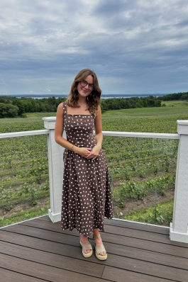 A photo of Taylor on a deck. 