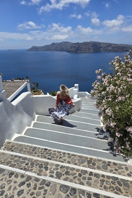 A phot of Kayla walking down steps in Greece.