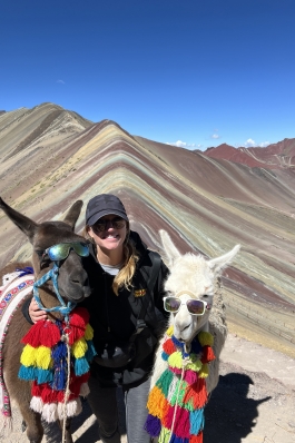 A photo of Micaela and llamas in Peru. 