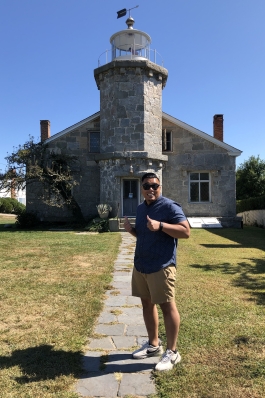 A photo of Bryan in front of a historic building. 