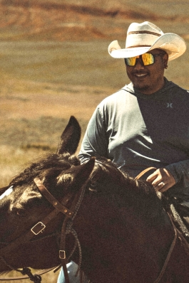 A photo of Bryan on horseback in Wyoming. 