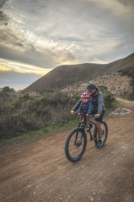 A photo of Gordy on a mountain bike.