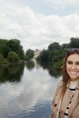 Nicole posing with a river in London.