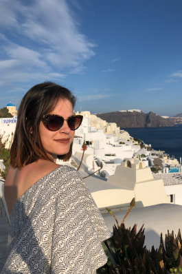 A photo of Rachel looking back at the camera in Greece. 