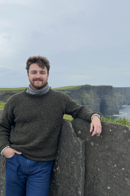 Jack posing near a wall in Ireland. 