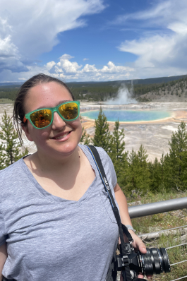 Kim taking a photo while exploring Yellowstone. 