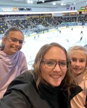 Amanda Steward and her daughters at a hockey game