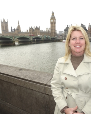 Camron Reid in London with Big Ben and the River Thames in the background