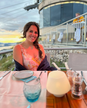 Cara Bettinger sits at a table at the top of the Dubrovnik cable car