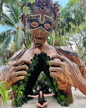 Carly Stedman Norosky sits at the base of a large sculpture in Costa Rica