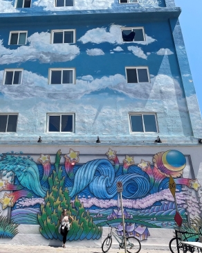 Carly Stedman Norosky in front of a mural in Venice, CA