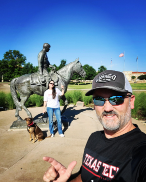 David Laffitte in front of a mural in Lubbock, TX