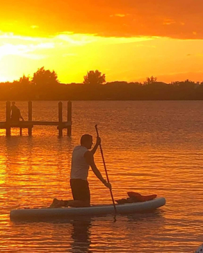 Jeff Coopes paddleboards in Spanish Point, FL