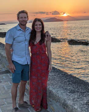 Kelli Chiri and the sunset on a seawall in Greece