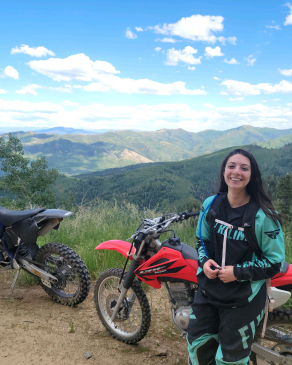 Miranda Maisto with dirt bikes on Utah