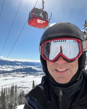 Mitch Knothe wearing ski gear next to the gondola at Jackson Hole, WY
